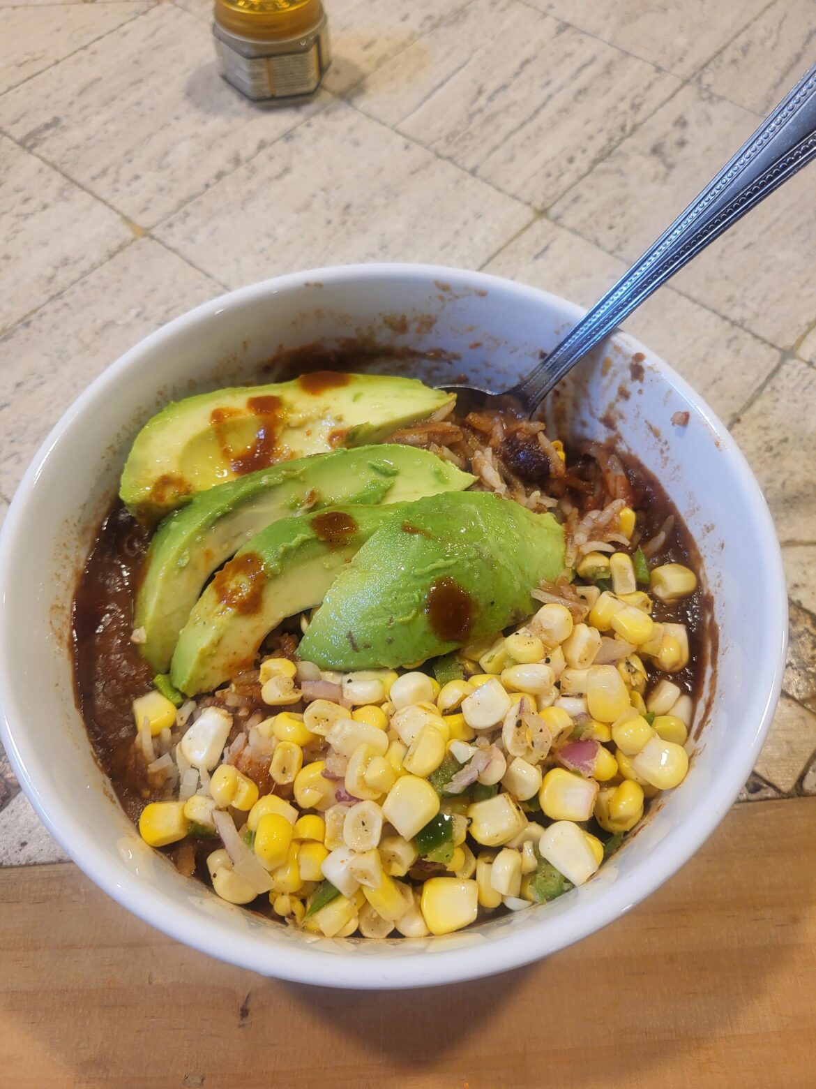 Black bean soup with rice, avocado and fresh corn salsa.