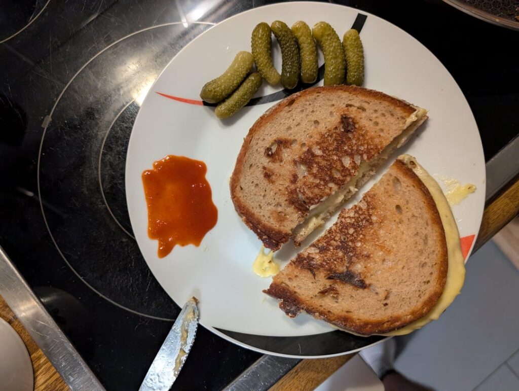 Pressing down on the bread when you don't have a dedicated weight (second picture)