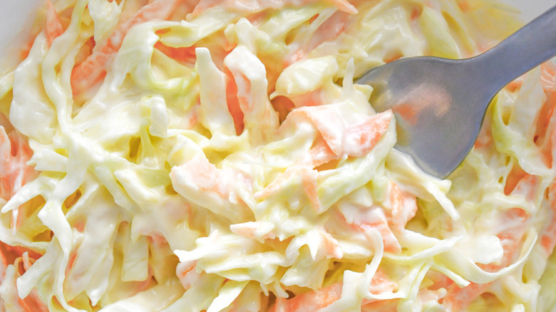 Coleslaw in a bowl with a fork