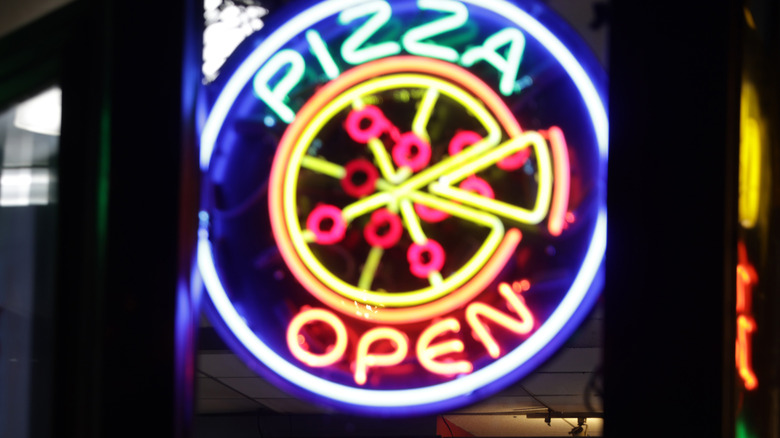 Neon pizza sign in DC