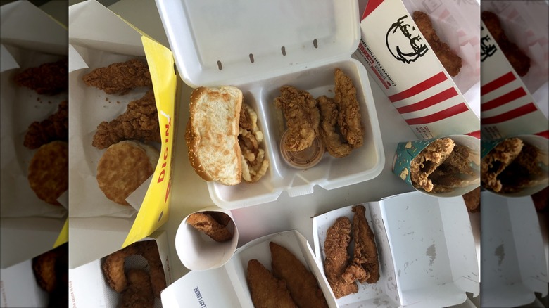 10 different fast food chicken tender orders in boxes and bags