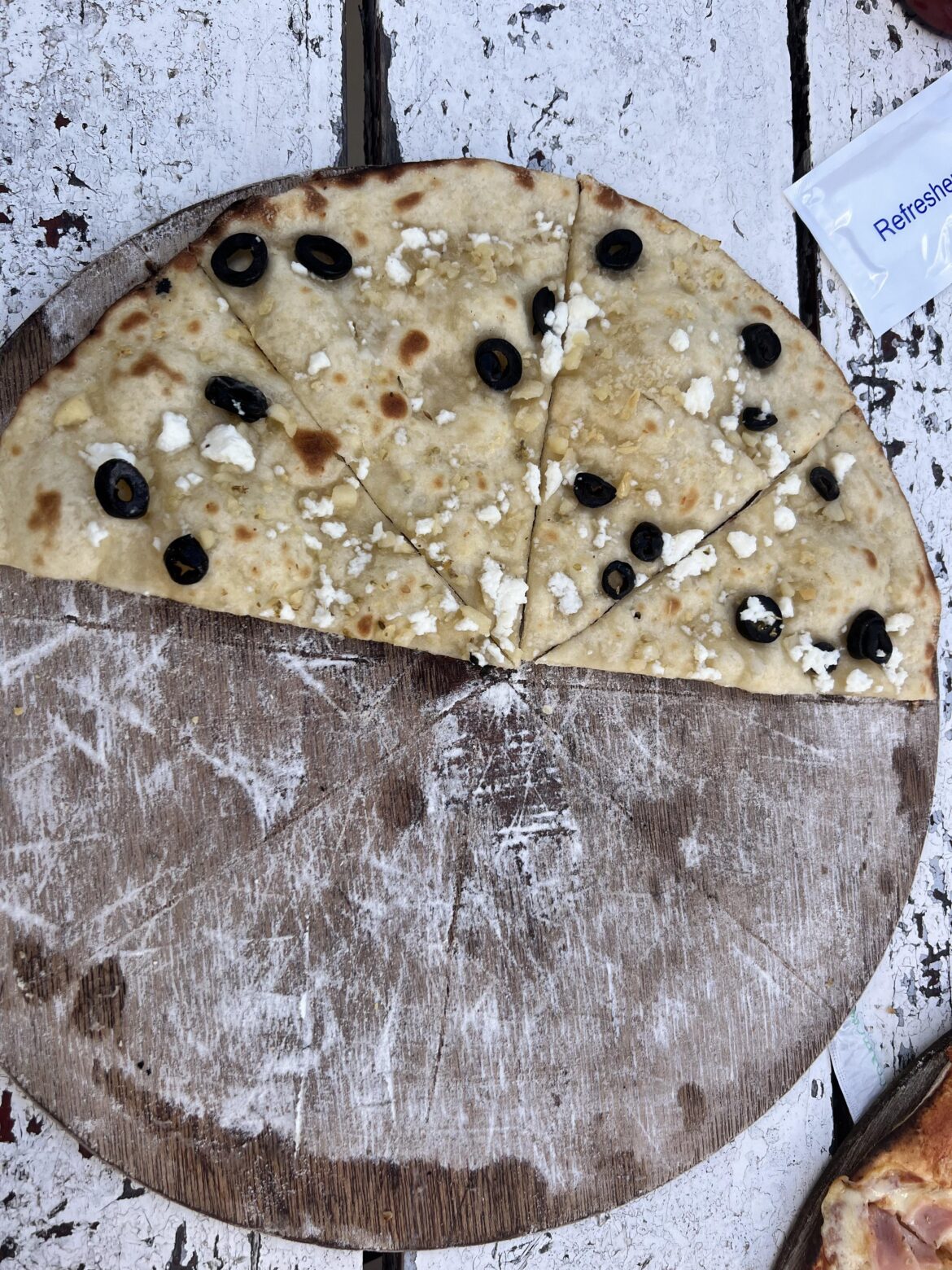 How many calories in this no tomato, no mozzarella pizza-feta and olives(I only ate half)
