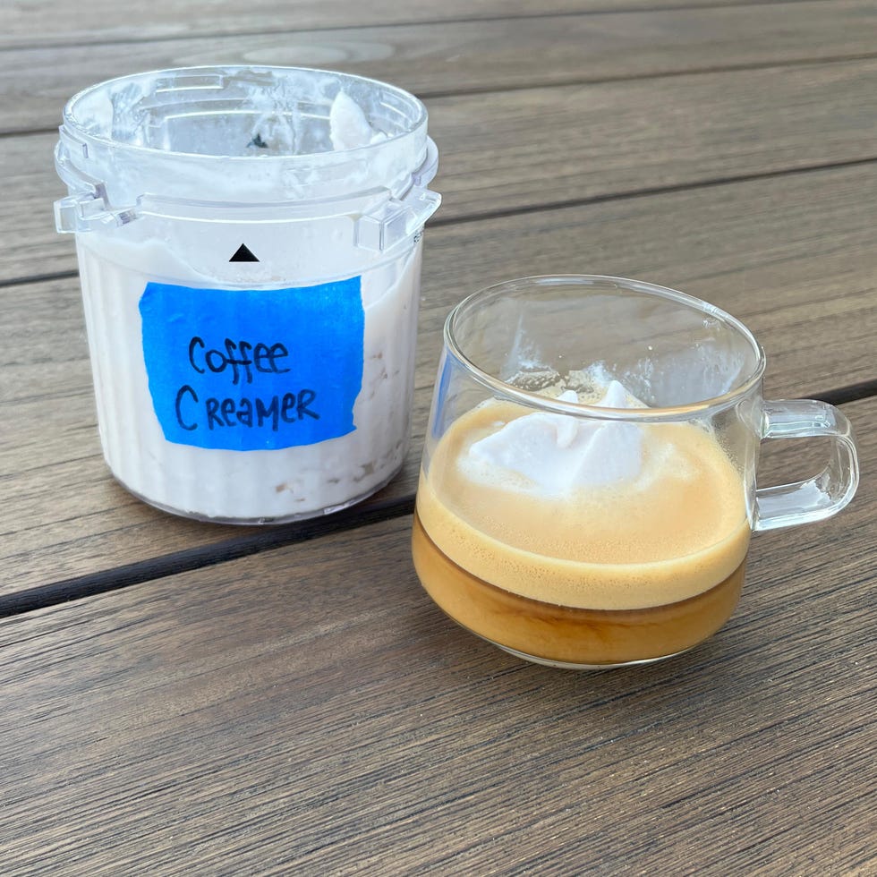 ninja creami pint of frozen blended coffee creamer next to a glass mug of espresso and affogato