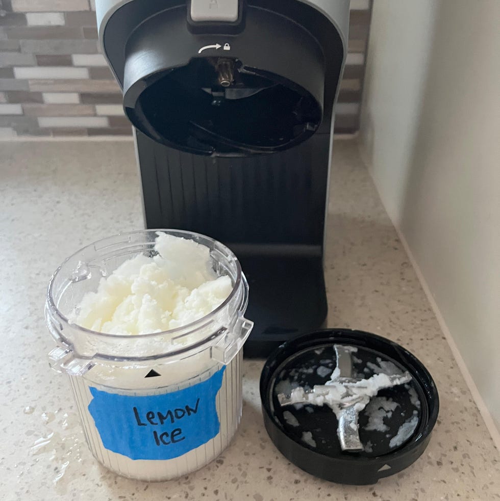 ninja creami pint and lid and machine with lemon ice inside