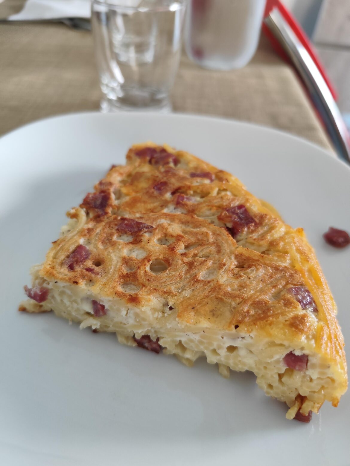 Spaghetti frittata with provolone and salame