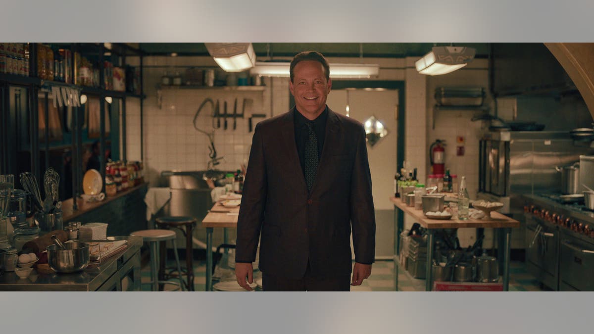 vince vaughn standing in a kitchen in nonnas
