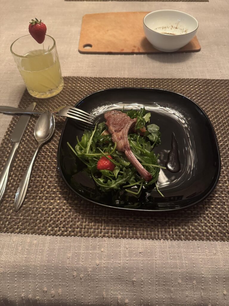 Dish 1: Lamb with Arugula and Balsamic sauce. Dish 2: Pound cake with ice cream and strawberry syrup