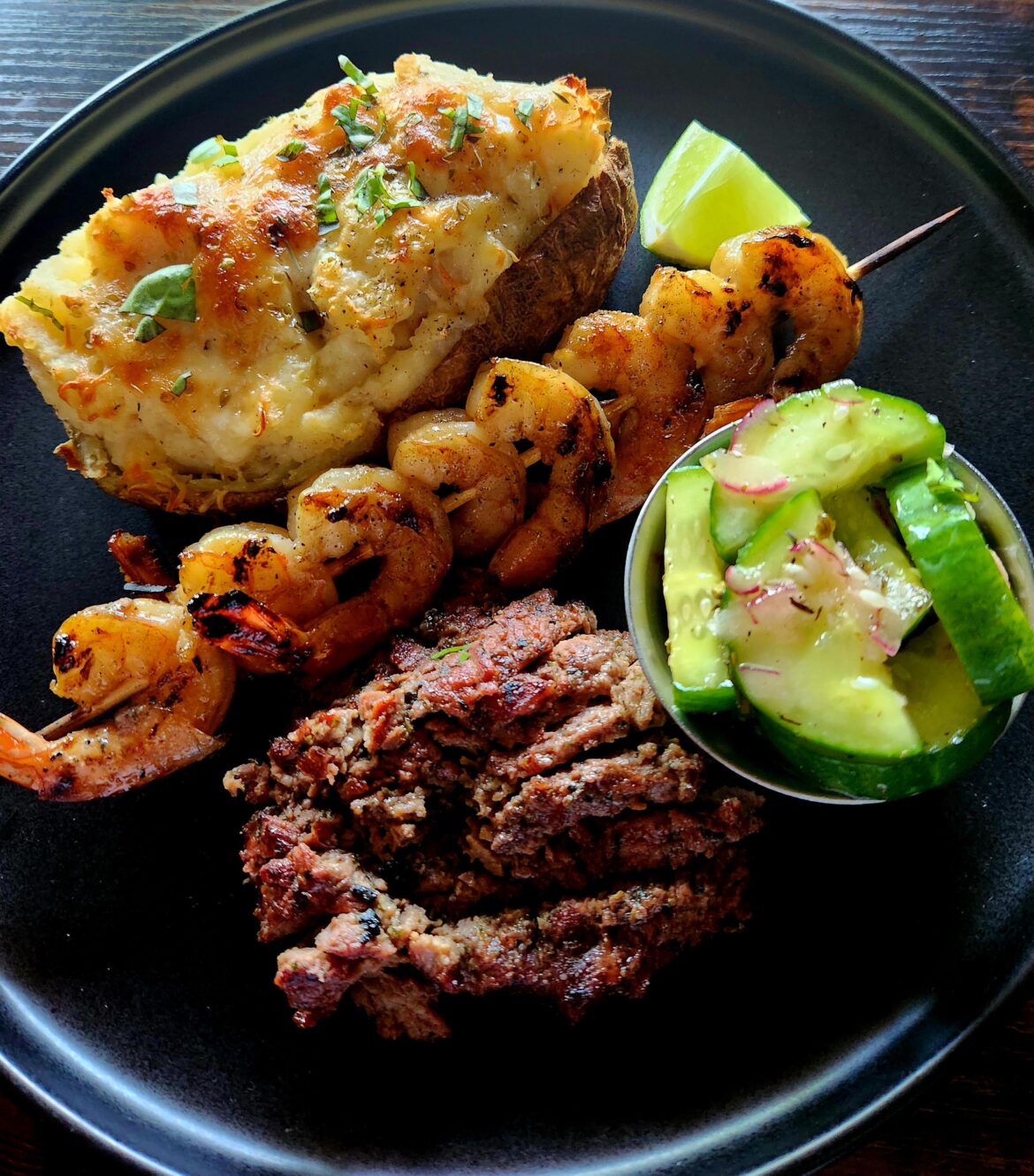 Grilled Garlic Lime Shrimp, Sirloin Medallions Skewers. Twice Baked Loaded Potato