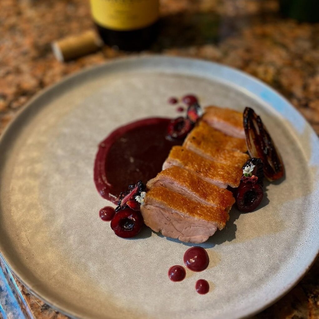 Duck breast with a cherry puree and cherry + red wine reduction