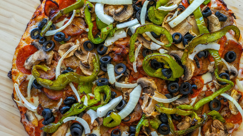 Cooked pizza loaded with toppings