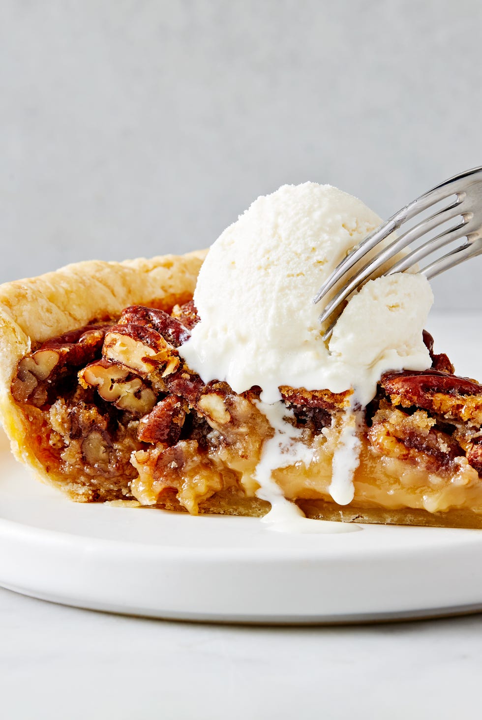 pecan pie with crunchy pecans and a flaky crust
