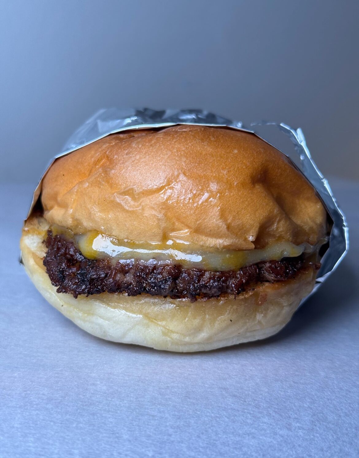 Trying a butter bun from the neighborhood Japanese bakery.