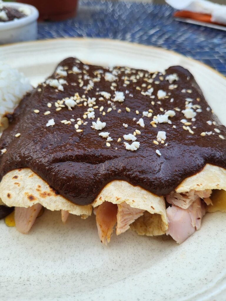 Smoked turkey enmoladas with mole negro.
