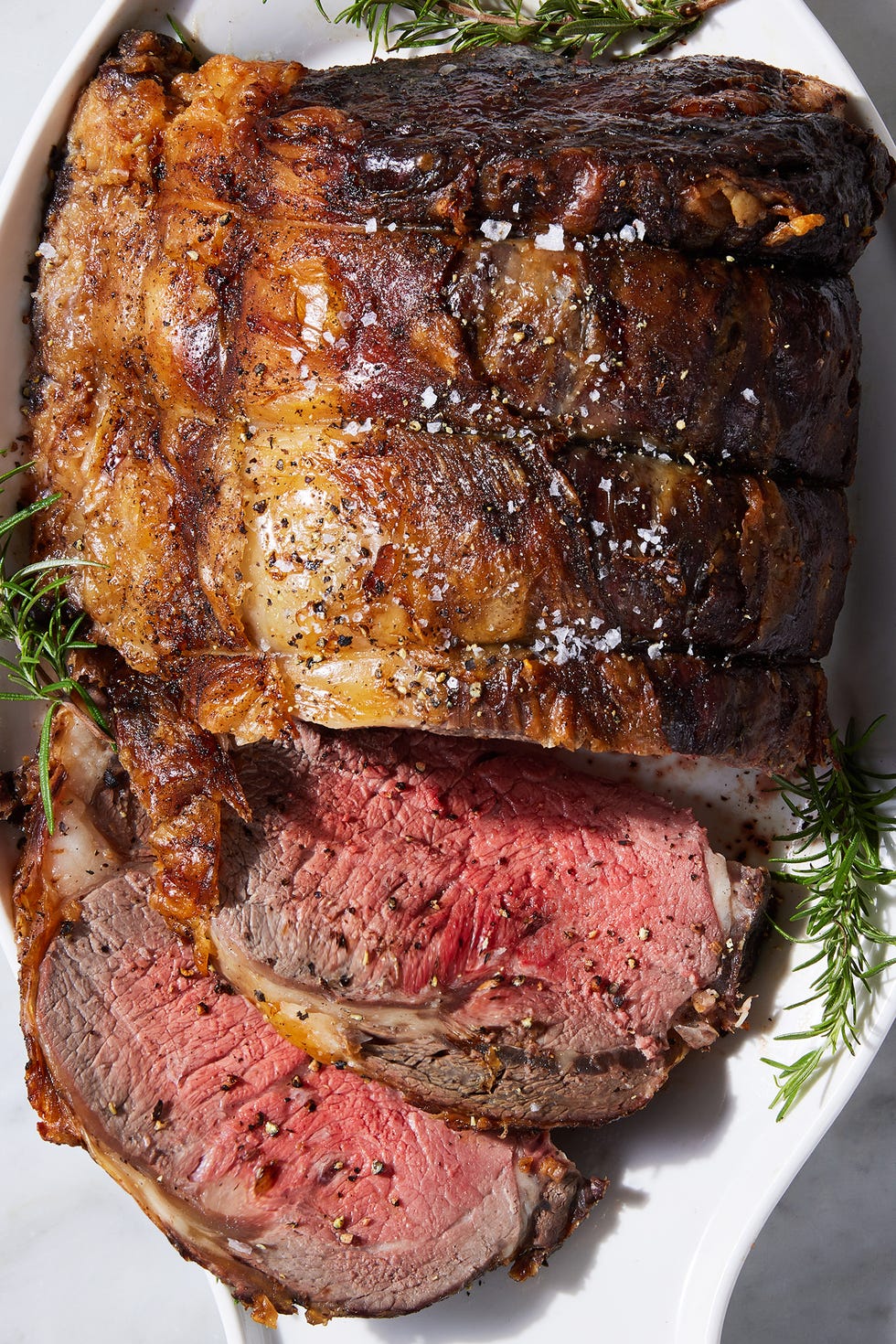 prime rib sliced with rosemary