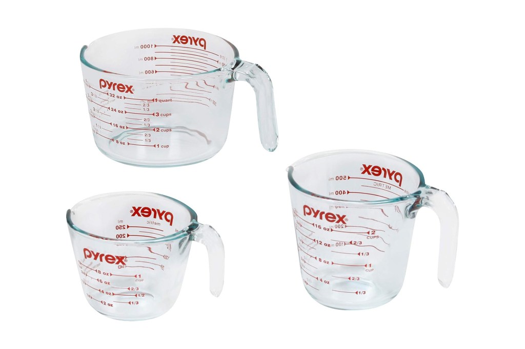 A group of Pyrex measuring cups