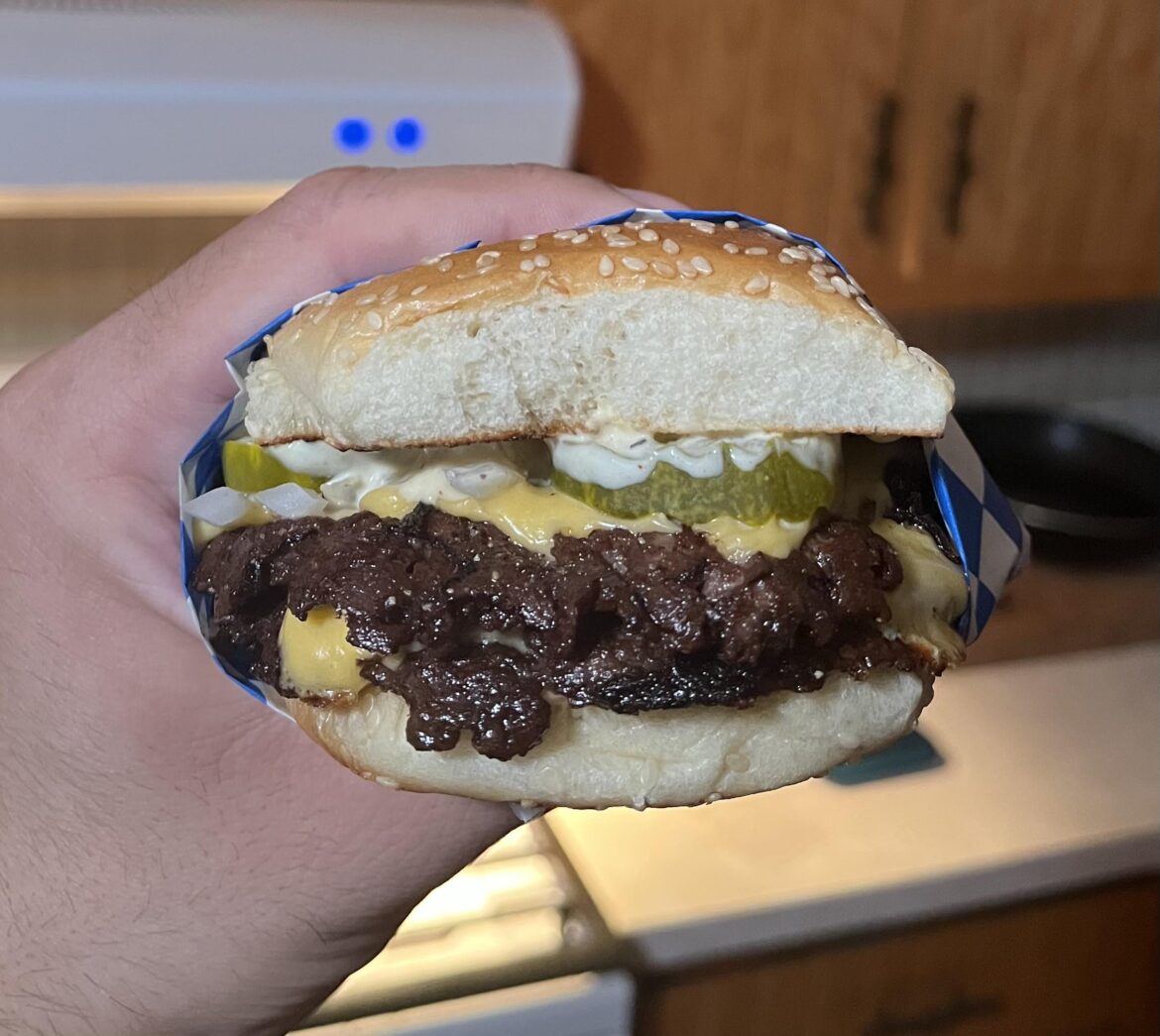 With dijonnaise, pickles, kraft deli American cheese, and diced onions.