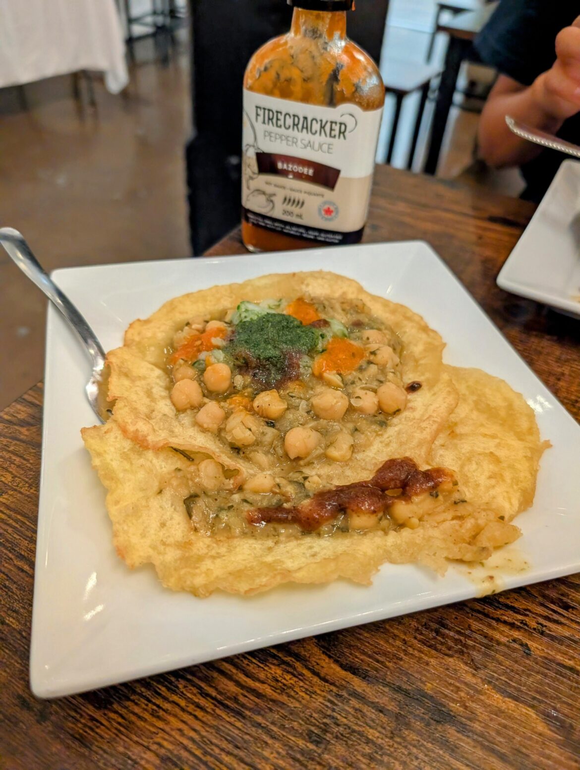 Firecracker (of hot sauce fame) now runs a Trinidadian restaurant in the Junction Triangle -- and the Doubles are to die for.