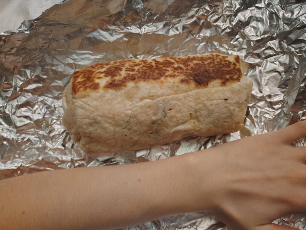 please an estimate? 7 inch burrito, had guac, sour cream, chicken & rice. tysm!!!