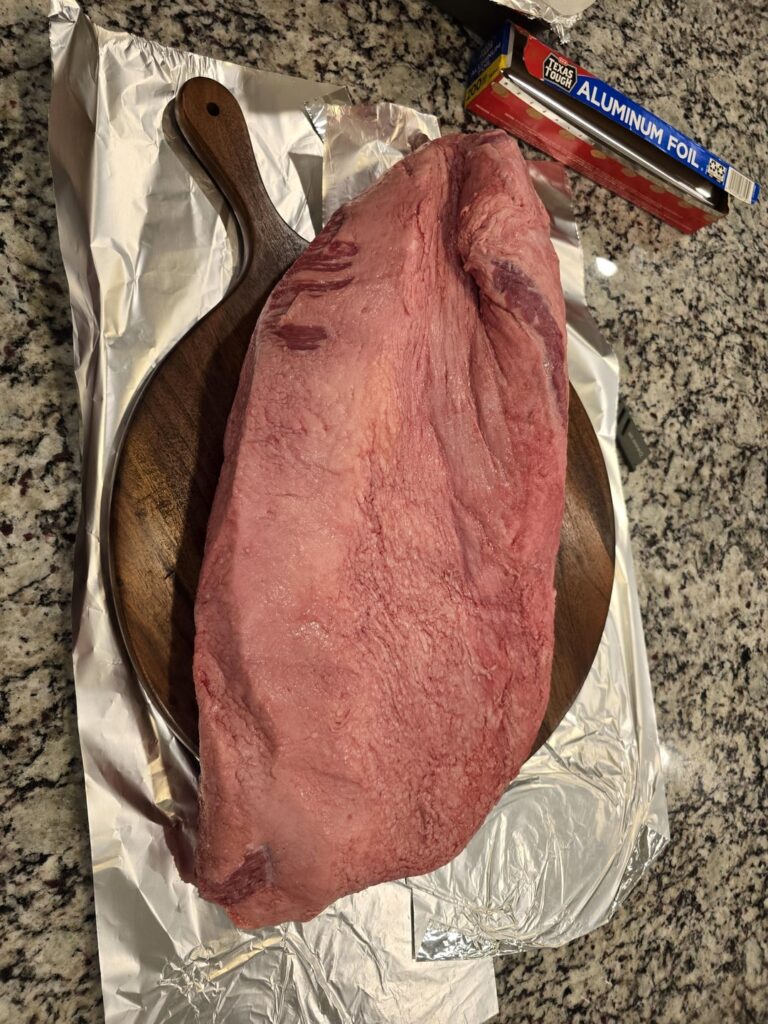 Before and after the trim on a 22lb ugly brisket