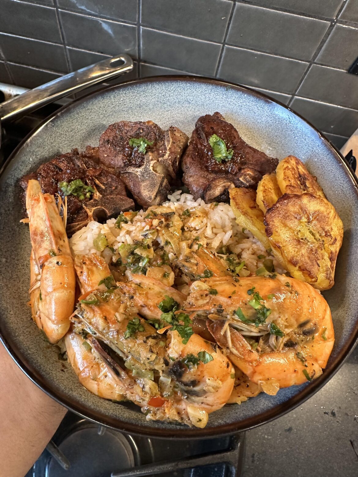 Caribbean style stewed shrimp, reverse seared lamb loin chops, fried sweet plantains and jasmine rice.