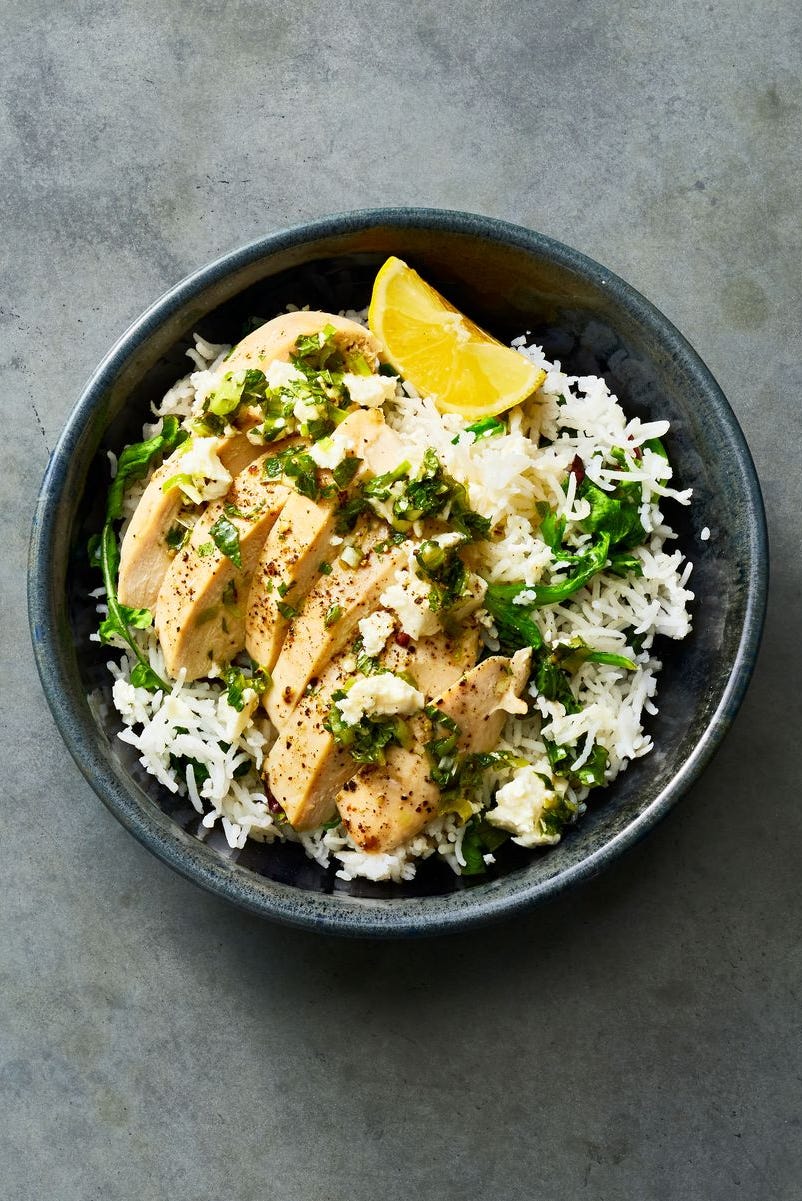 chicken and rice with feta and mint in a bowl