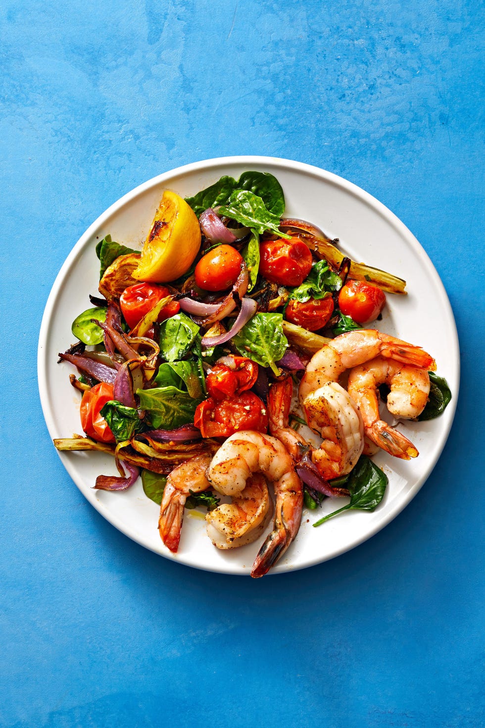 healthy roast shrimp and salad on a plate