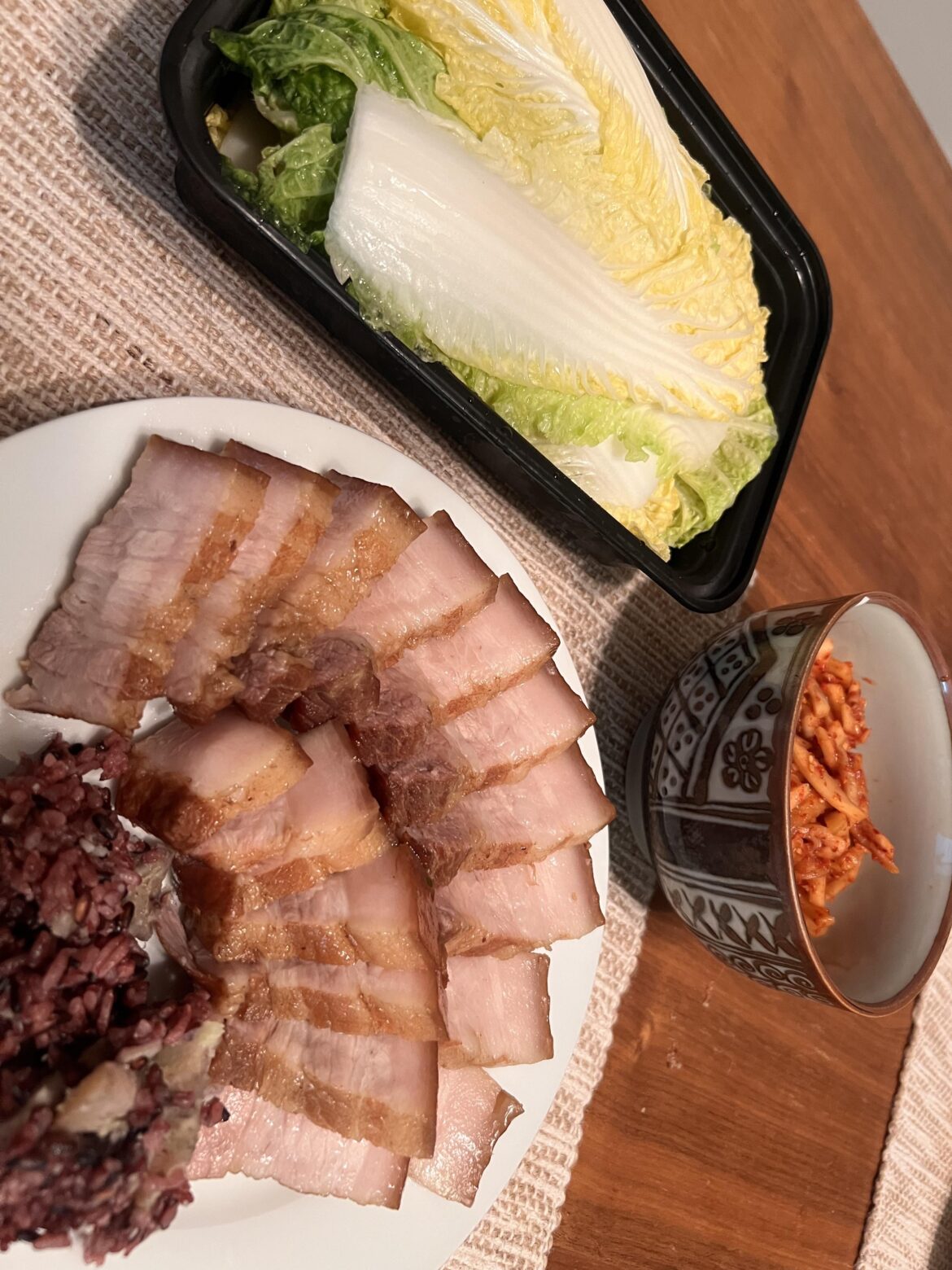 My first Bossam! No oysters on hand, but freshly pickled cabbage leaves and radish kimchi + purple rice and sweet potato mix.