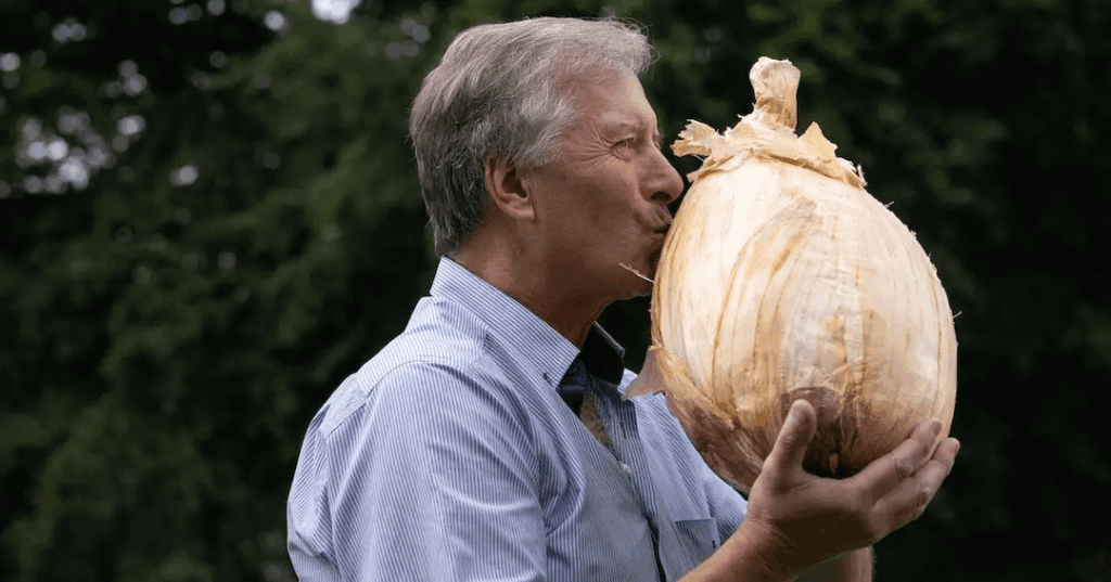 Gareth Griffin from Guernsey, who grew the world's heaviest onion at 19 lbs 12.4 oz (8.97 kg)