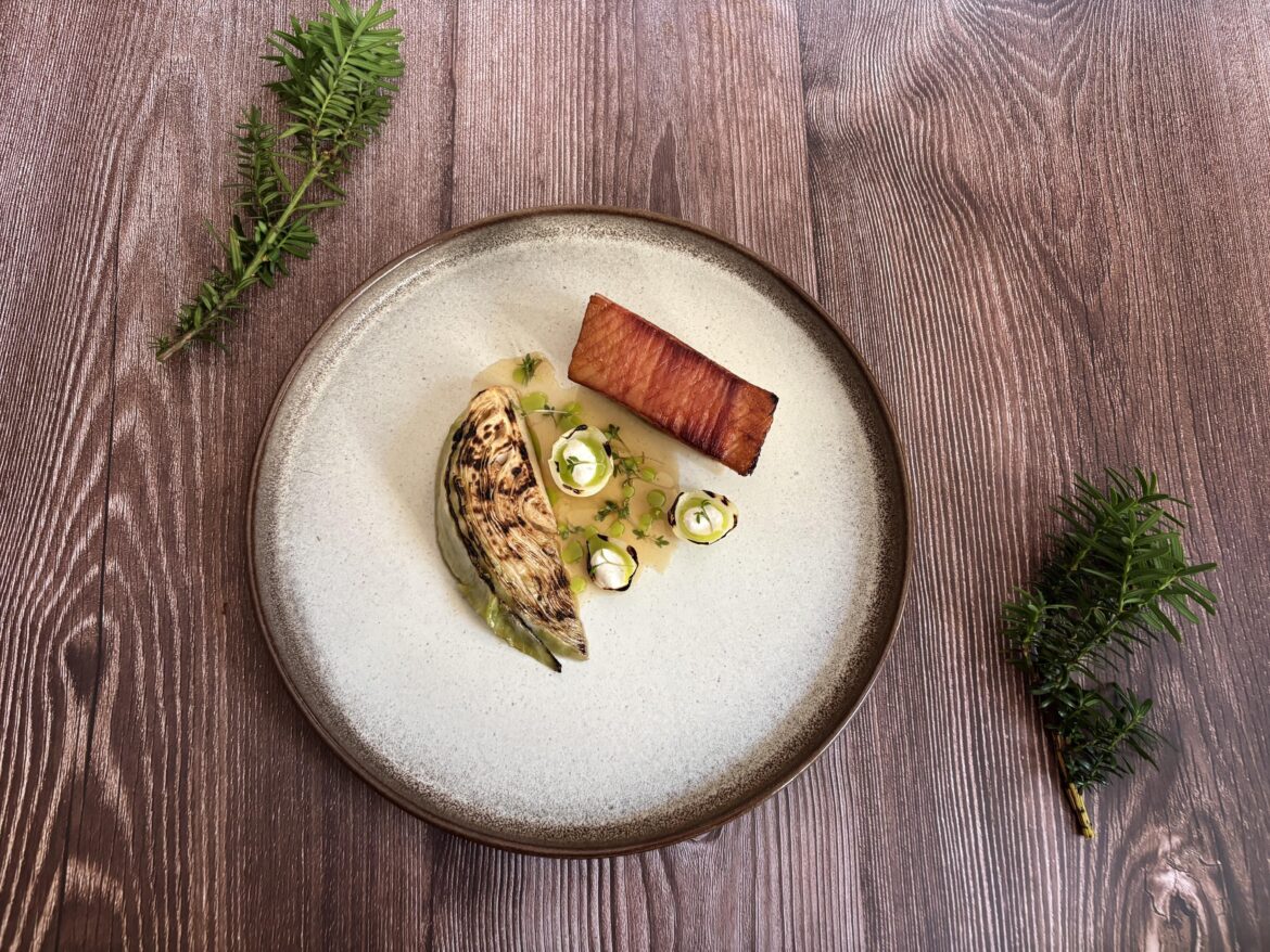 Glazed Pork Belly, Young Cabbage, Burnt Onion Cream, Wild Garlic Oil & Pickled Mustard Seeds