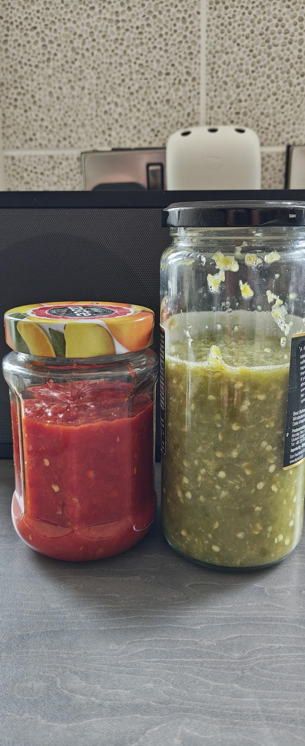 Homemade green chilli sauce and scotch bonnet pepper sauce.