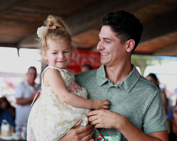 This dad-daughter combination pose during a break in a cutest baby contest at a previous Festa Italiana at Freedom Hill County Park in Sterling Heights. (MACOMB DAILY FILE PHOTO)