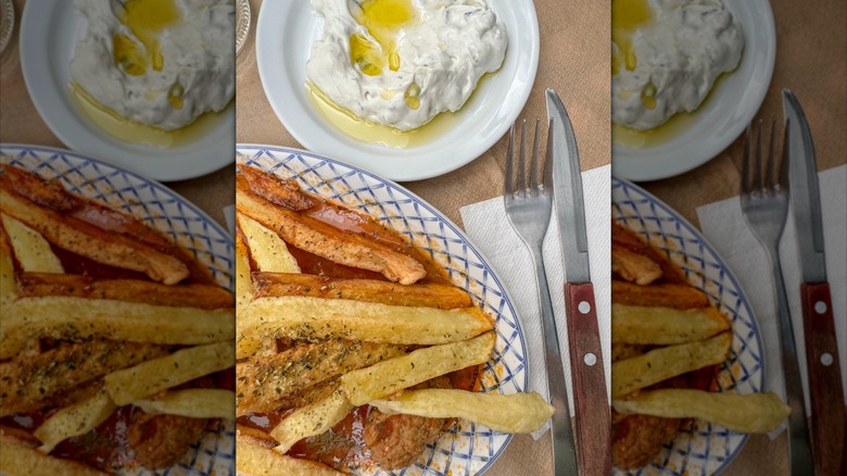 Tzatziki wtith fries on a plate