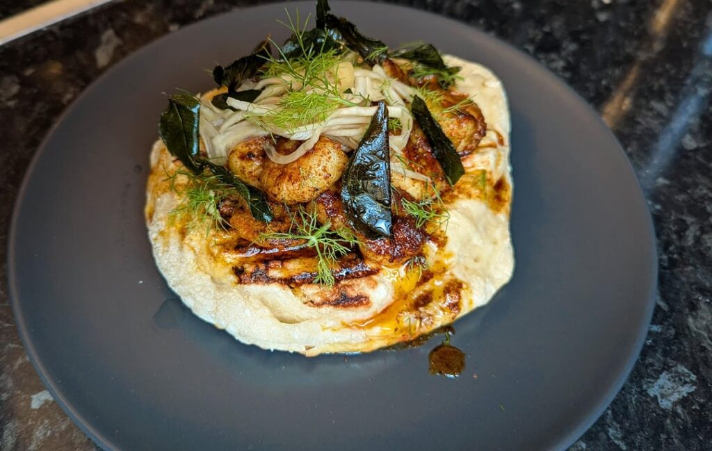 Prawn flatbread, mitmita spiced butter, pickled fennel, curry leaves