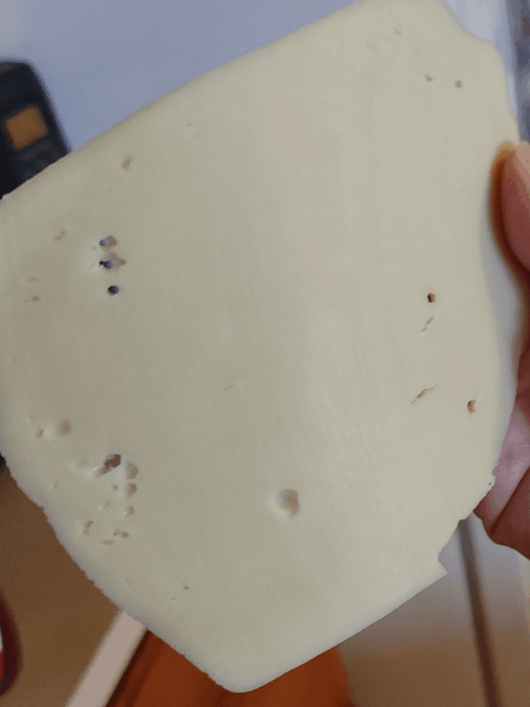 So I was gifted this via wrong Walmart order. The label said Swiss cheese but lacking the typical sized holes I'm thinking it's something else?