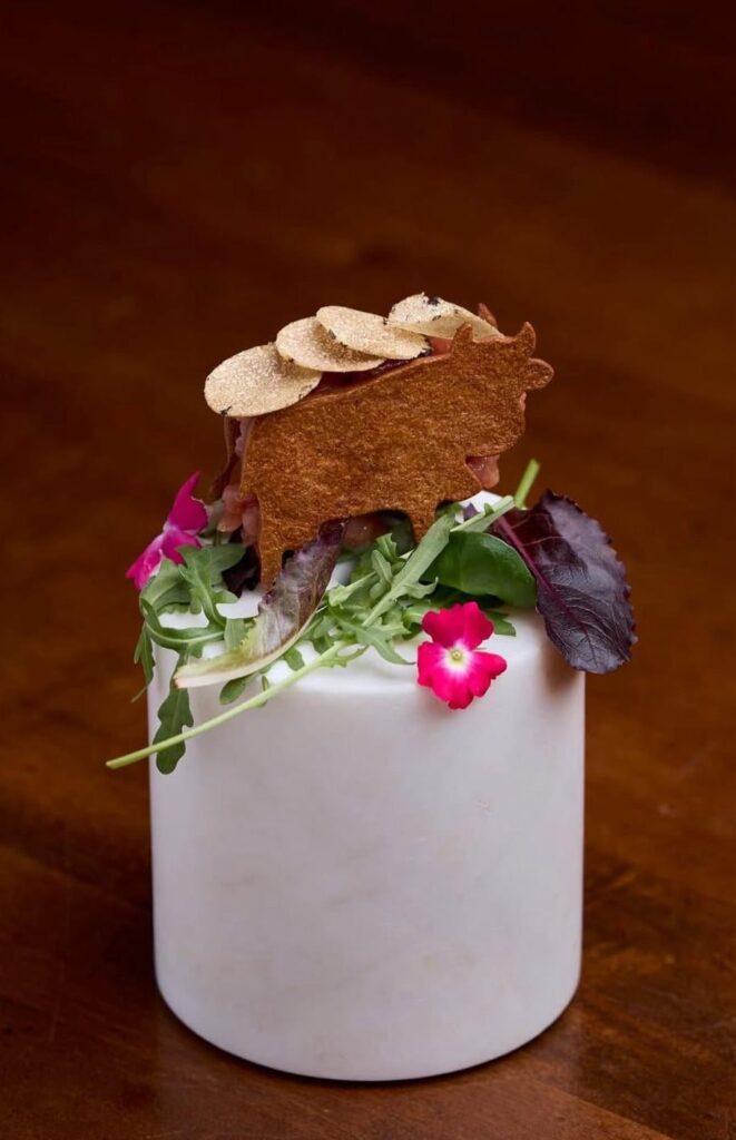 Sourdough discard wafer, Chianina tartare with beef Garum, truffle.