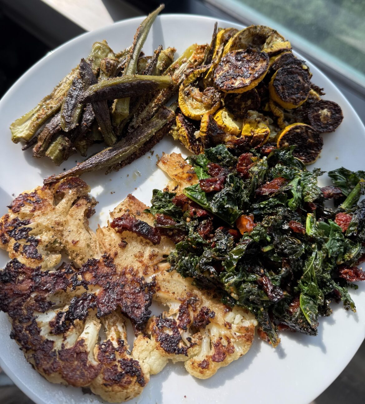 Cauliflower steak, roasted fancy okra, summer yellow squash, organic kale greens infused with Italian sun-dried tomatoes