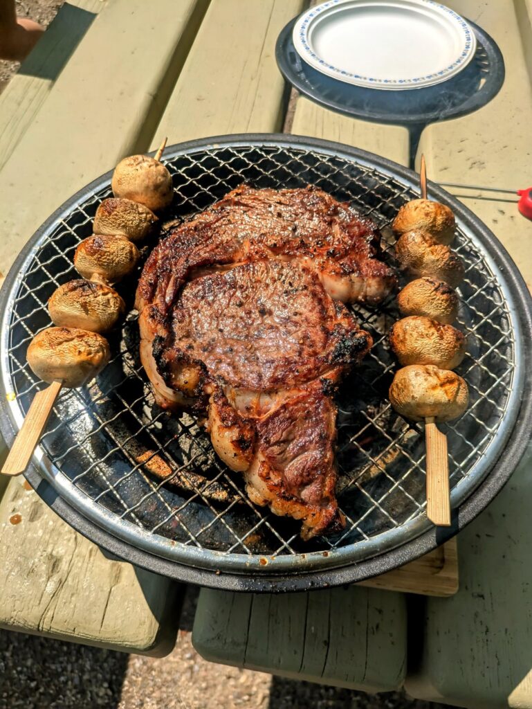 Cooked a Ribeye steak on a 50$ portable charcoal grill at the park Cooked a Ribeye steak on a 50$ portable charcoal grill at the park