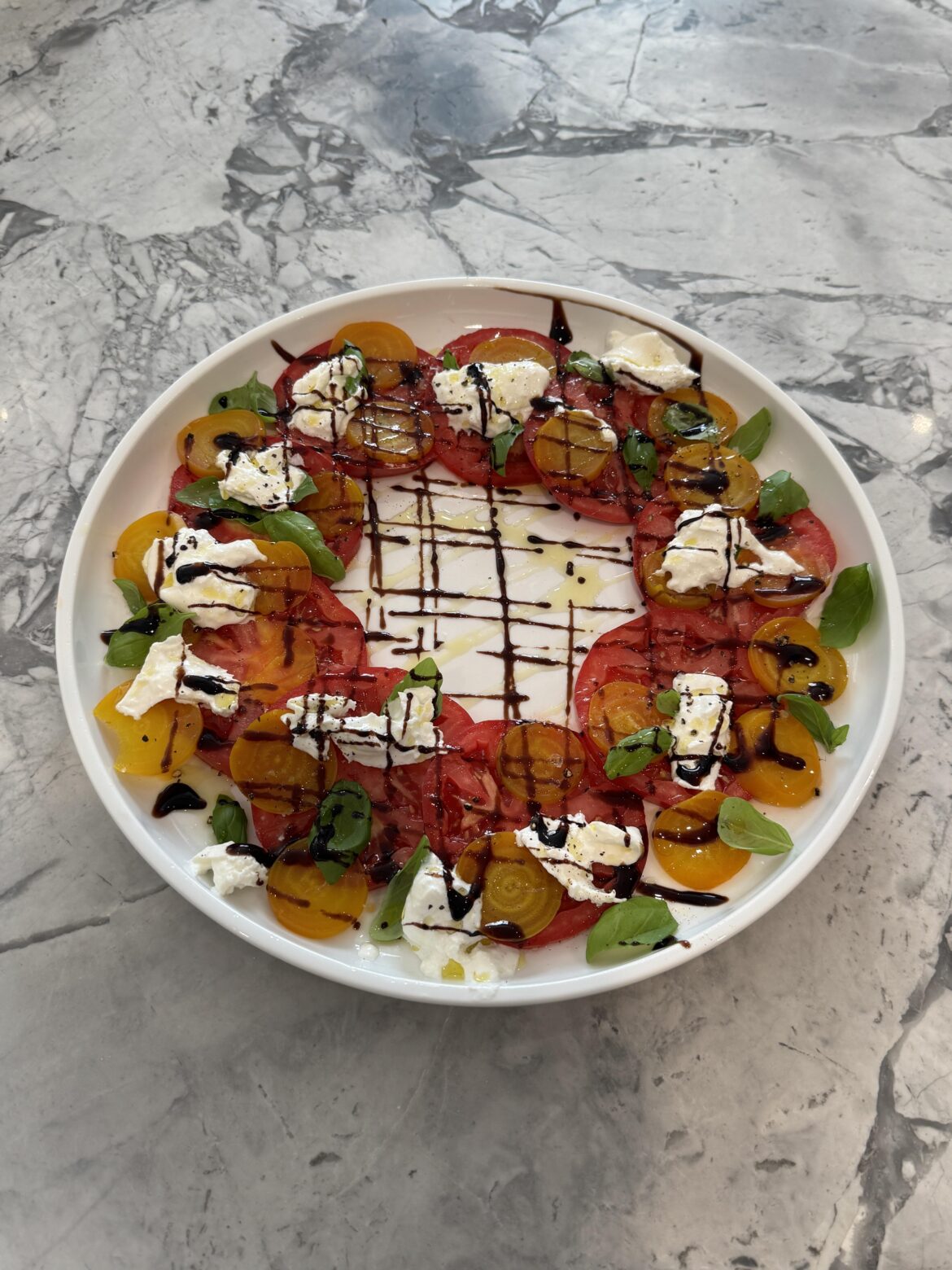 Tomatoes, golden beats from our garden, burrata cheese, olive oil, balsamic, malden salt, basil. All prepared by my lovely wife.
