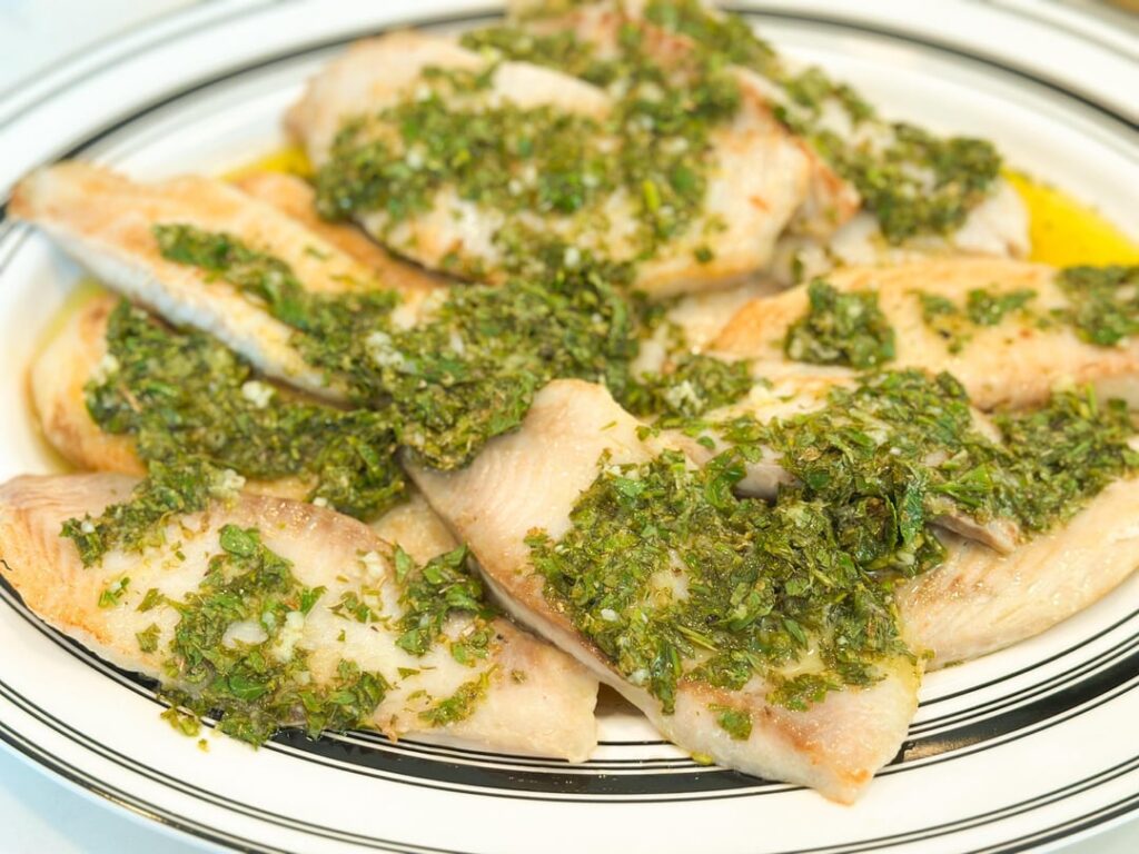 Sautéed Tilapia by Steve Dunn from Cook’s Illustrated, Jan./Feb. 2019 with Adam Reid’s Lemon, Garlic, and Herbs topping from his Grilled Swordfish Salmoriglio from Cook’s Illustrated, July/August 2024