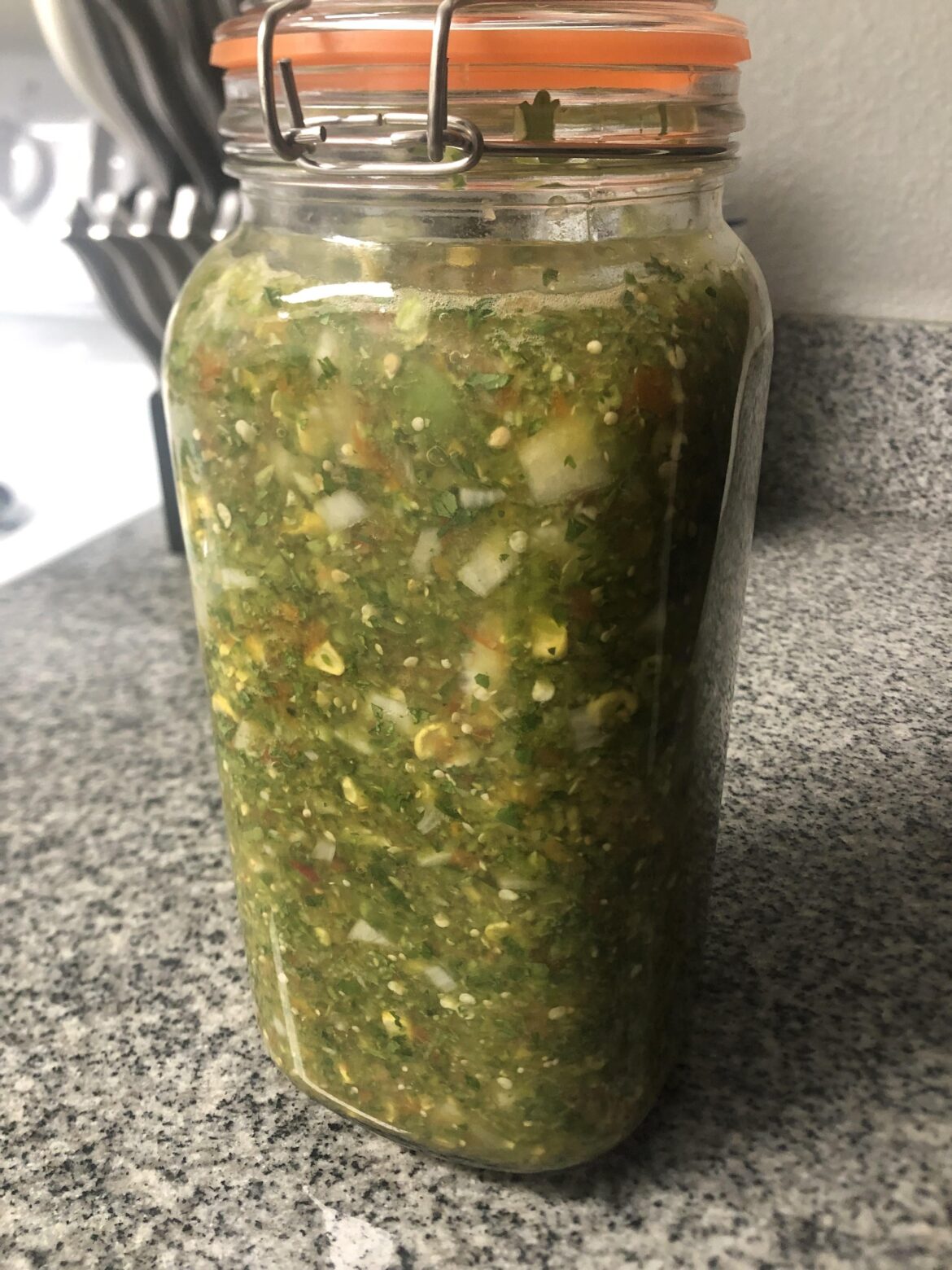 Fermented tomatillo, heirloom tomato, house tomato, grilling onion, white onion, jalapeño, Serrano, yellow corn, cilantro and lime salsa.