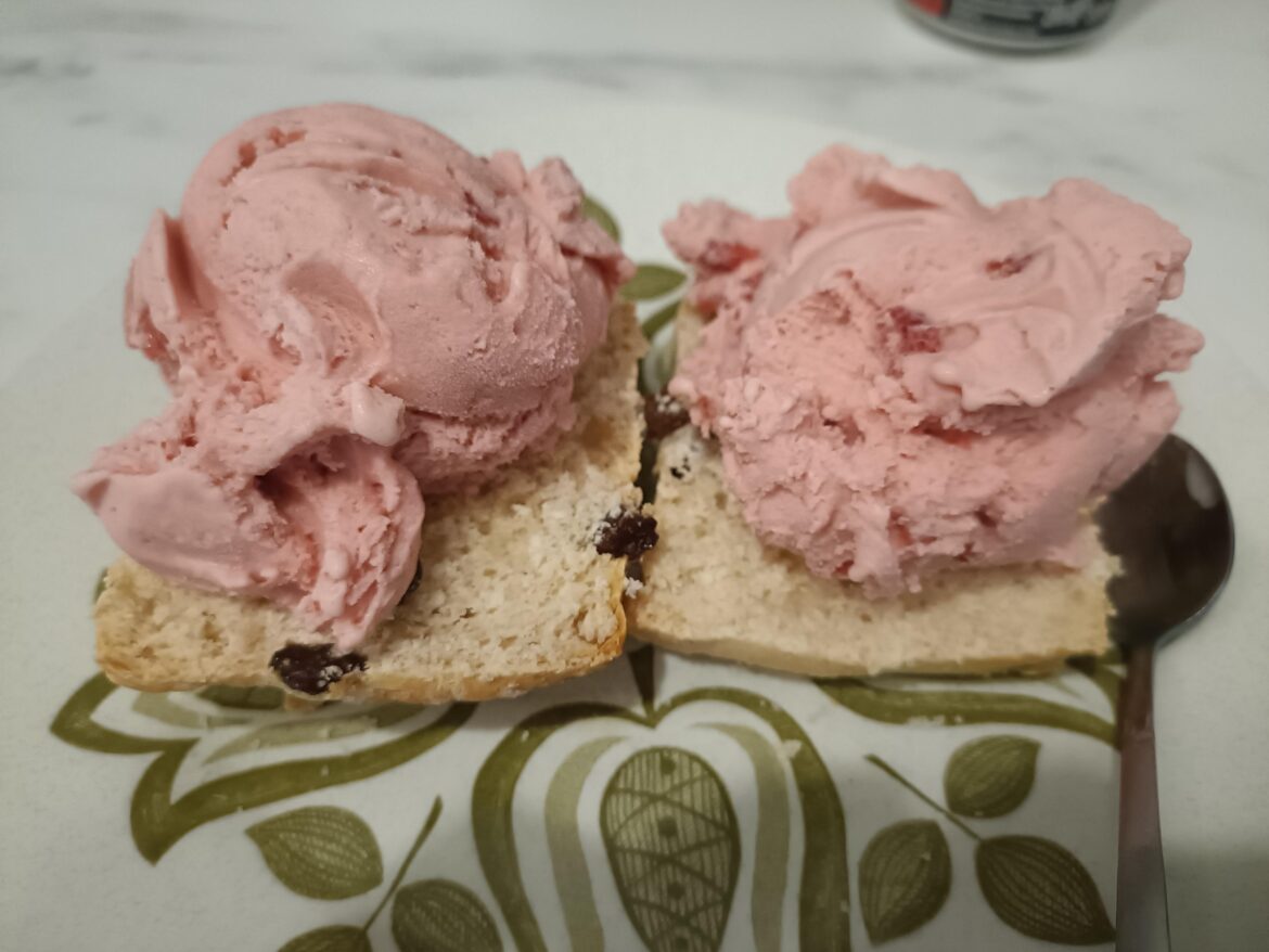 Strawberry ice cream on a scone.