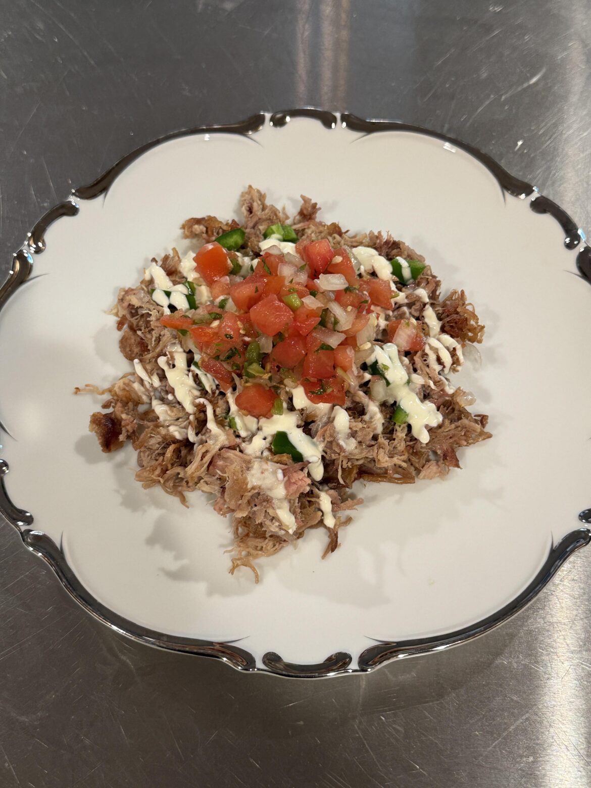 Pulled pork, chopped jalepeno, a drizzle of crème fraiche and some pico de gallo!