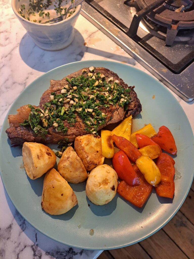 Steak dinner with homemade chimichurri