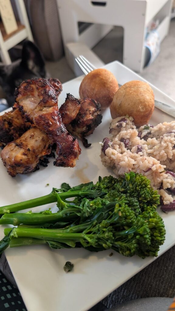 Jamaican jerk, rice and peas with sourdough dumplings. Then old school sponge with chocolate custard for dessert