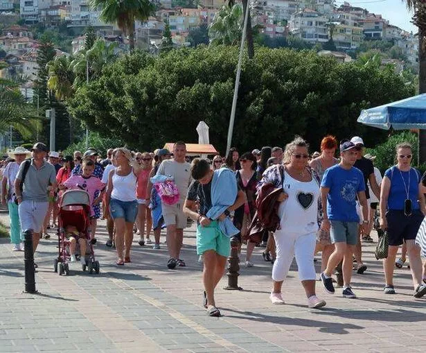 Crowds of tourist on busy seafront promenade, Alanya, Turkey