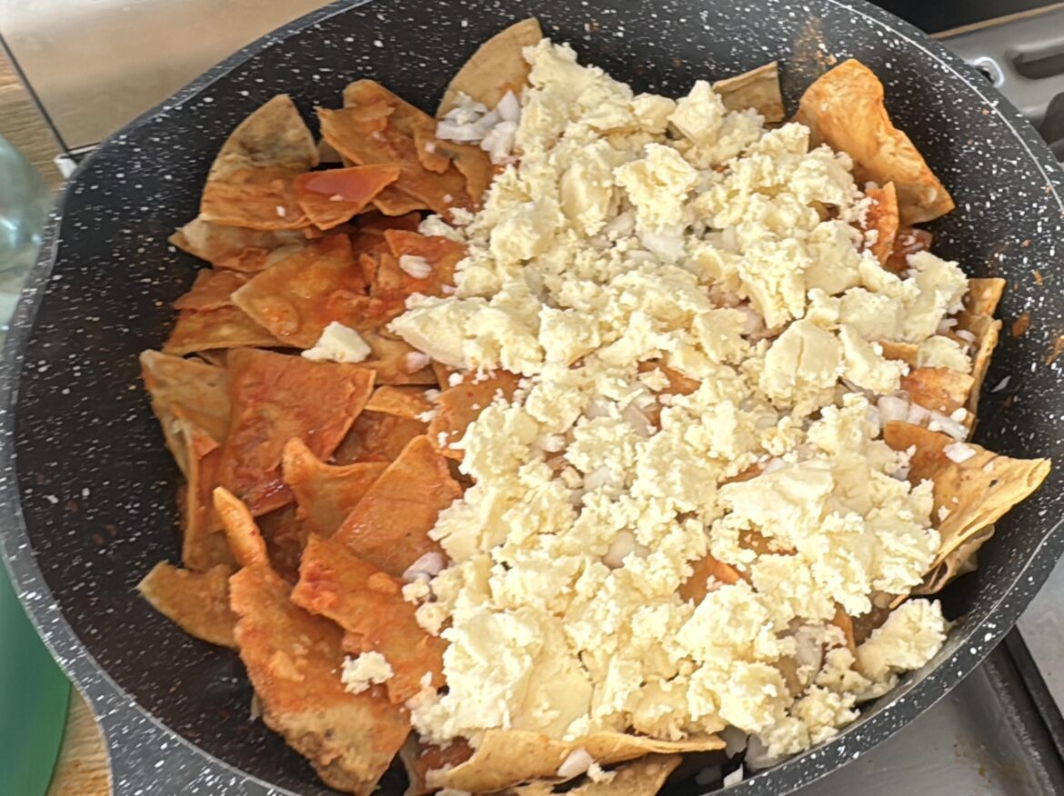 some chilaquiles with lots of cheese and onion