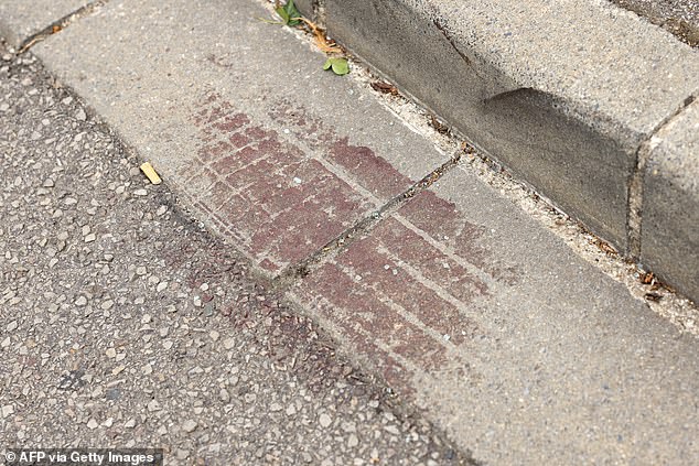 The incident took place in the town of Evreux in the northern French region of Normandy at around 4.00am on Saturday (2.00am GMT). Images shows blood stains on the road outside La Winery bar.