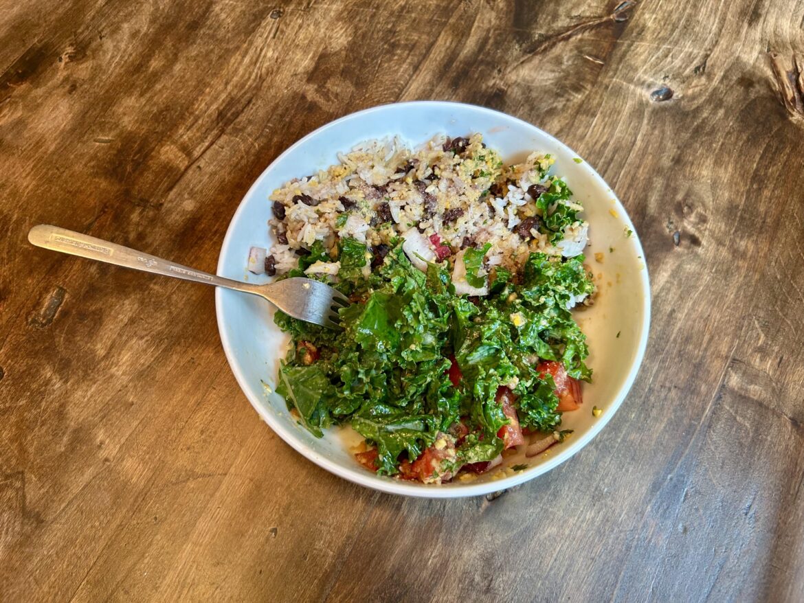 Kale salad with rice & beans and homemade tahini dressing
