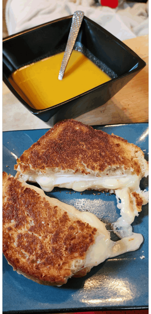 Sourdough grilled cheese with butternut squash soup.