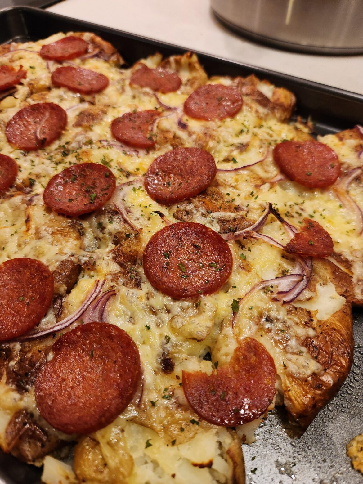 Had no pizza bases so... roast potato pizza was created